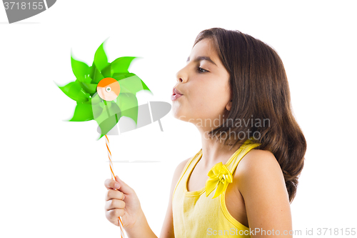 Image of Girl blowing a windmill