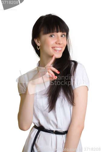 Image of Friendly smiling young woman portrait studio shot