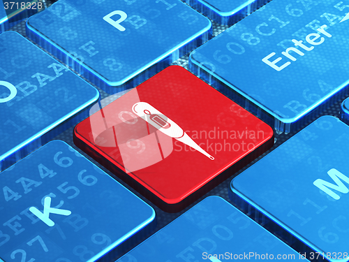 Image of Medicine concept: Thermometer on computer keyboard background