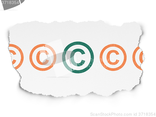 Image of Law concept: copyright icon on Torn Paper background