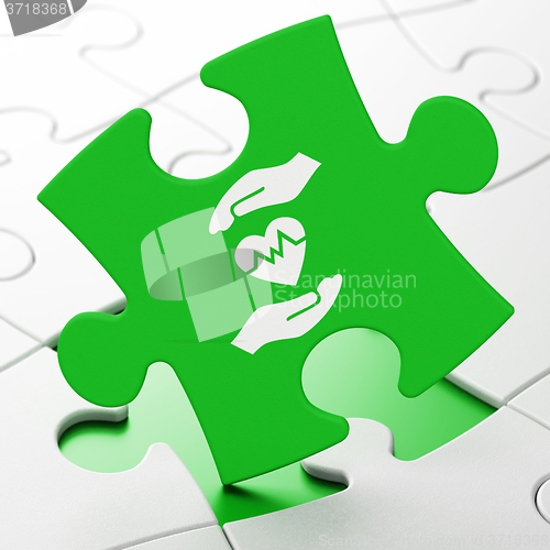 Image of Insurance concept: Heart And Palm on puzzle background