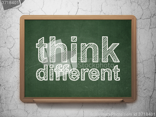 Image of Education concept: Think Different on chalkboard background