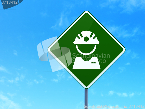 Image of Industry concept: Factory Worker on road sign background