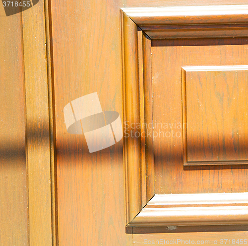 Image of texture of a brown old door in italy europe