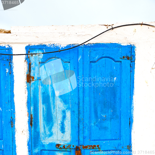 Image of in africa morocco  old harbor wood   door and the blue sky