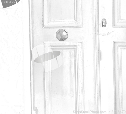 Image of white  red brown  door in antique village santorini greece europ