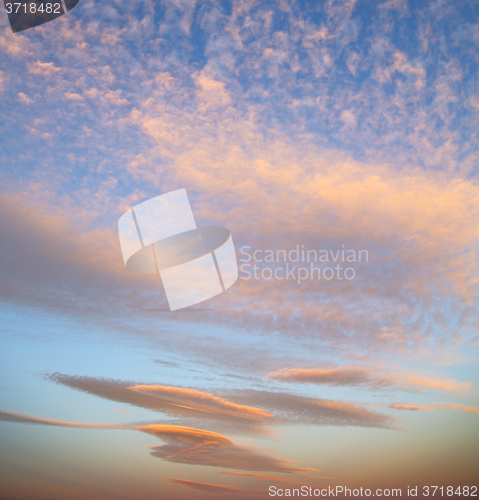 Image of sunrise in the colored sky white soft clouds 