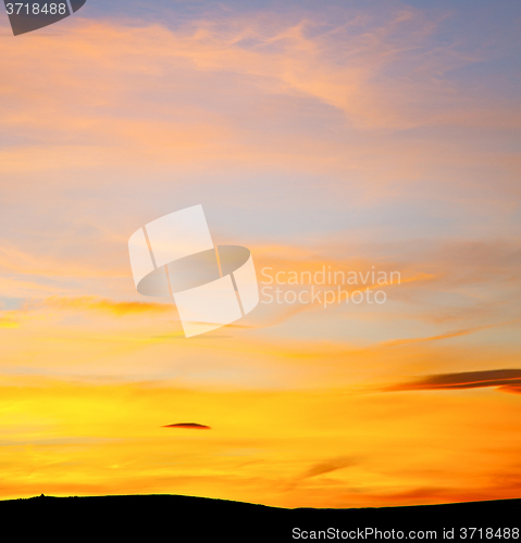 Image of sunrise in the colored sky white soft clouds and abstract backgr