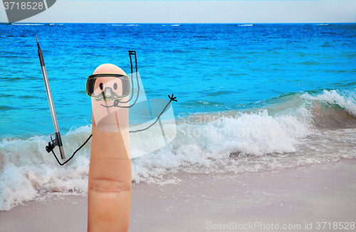 Image of Diver with harpoon gun on the beach