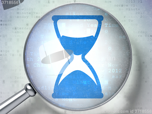 Image of Time concept: Hourglass with optical glass on digital background