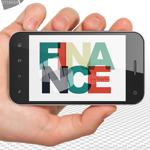 Image of Banking concept: Hand Holding Smartphone with Finance on  display