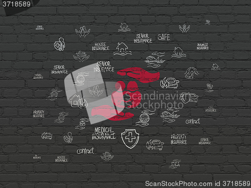 Image of Insurance concept: Family And Palm on wall background