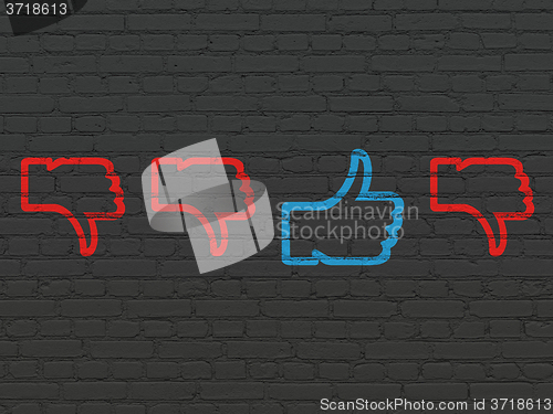 Image of Social media concept: thumb up icon on wall background