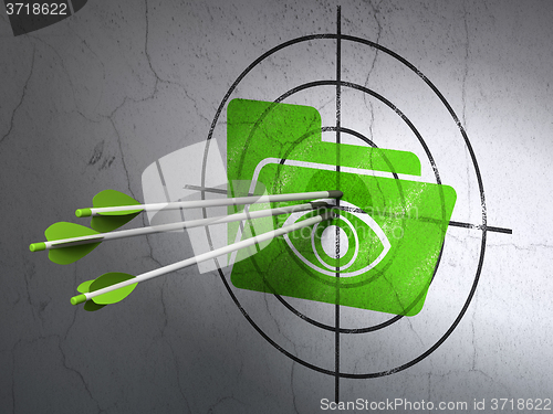 Image of Business concept: arrows in Folder With Eye target on wall background