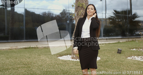 Image of Young professional woman standing waiting