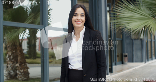 Image of Smiling friendly young businesswoman