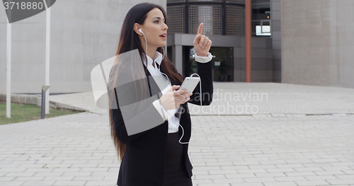 Image of Young businesswoman talking on her mobile