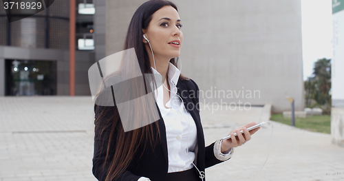 Image of Young woman listening to a mobile call