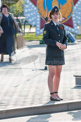 Image of Young policewoman - sergeant protects an order