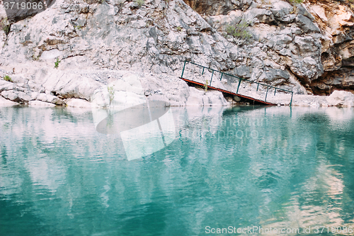 Image of Bridge in the mountains with river