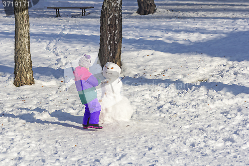 Image of Child make snowmen