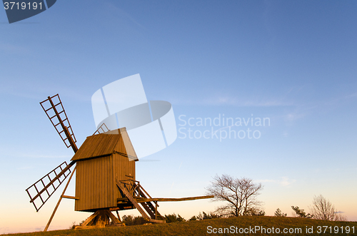 Image of Sunlit old traditional windmill