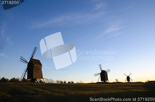 Image of Old windmills in a row