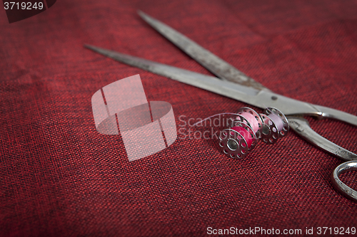 Image of red fabric scissors