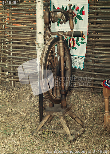 Image of Antique wooden spinning wheel