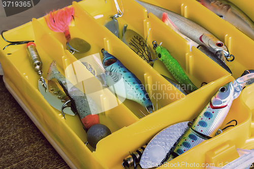 Image of Fishing tackle: a set of spoons in the container.