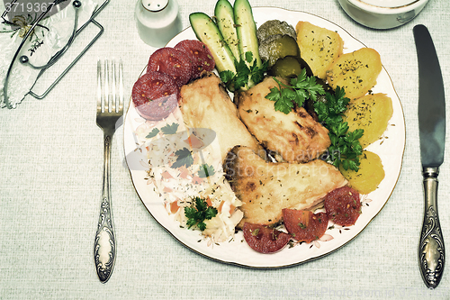 Image of Baked fish and vegetables . The view from the top.