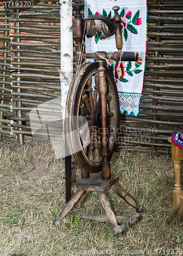 Image of Antique wooden spinning wheel