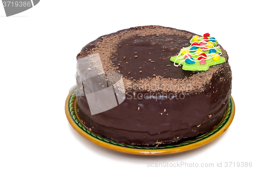 Image of Chocolate cake on a ceramic dish on white background.