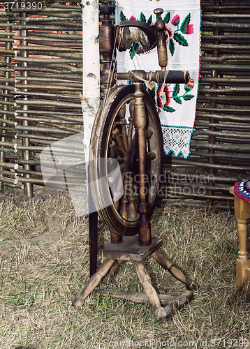 Image of Antique wooden spinning wheel