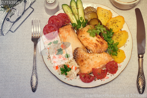 Image of Baked fish and vegetables . The view from the top.