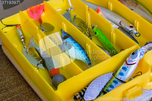 Image of Fishing tackle: a set of spoons in the container.