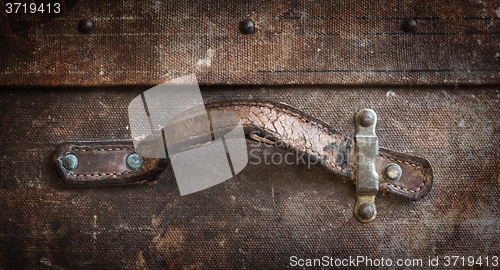 Image of Old canvas trunk handle close up