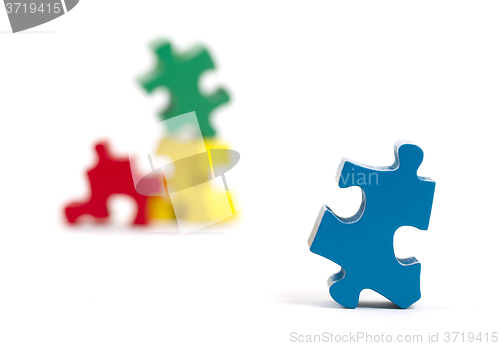 Image of Closeup of big jigsaw puzzle piece, perspective