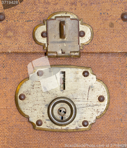 Image of Old canvas trunk lock close up