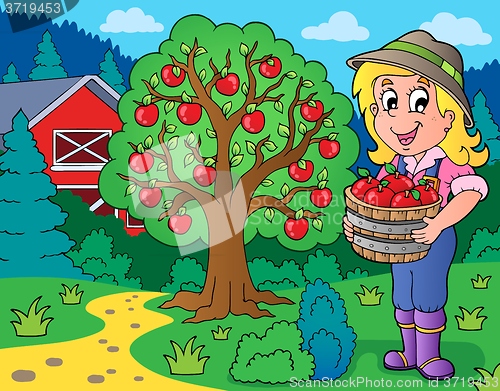 Image of Farm girl with collected apples