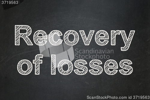 Image of Money concept: Recovery Of losses on chalkboard background