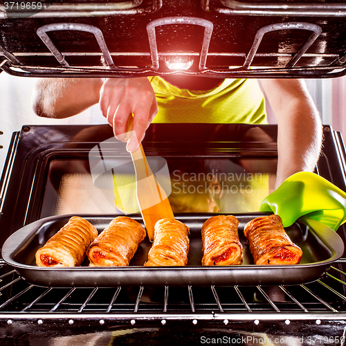 Image of Cooking in the oven at home.