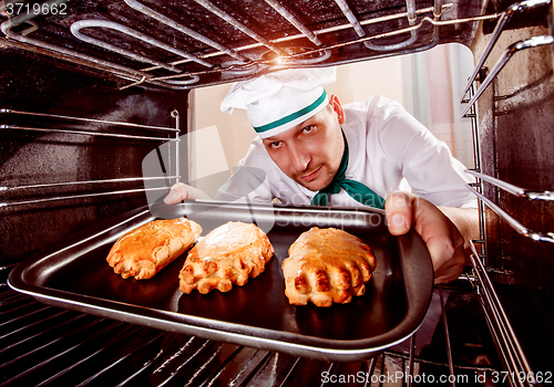 Image of Chef cooking in the oven.