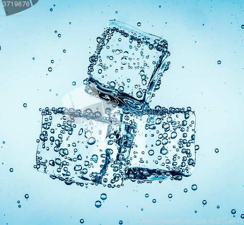 Image of Ice cubes falling under water