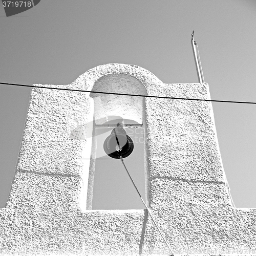 Image of in cyclades      europe greece a cross the cloudy sky and bell