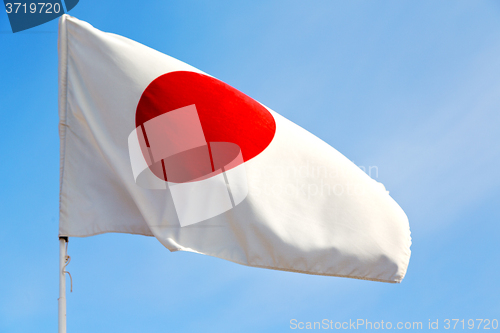 Image of japanb waving flag in the  sky   and wave