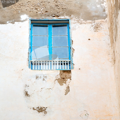 Image of blue window in morocco africa old construction and brown wall  c