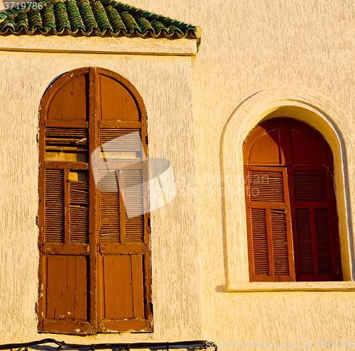 Image of   yellow window in morocco africa old construction and brown wal