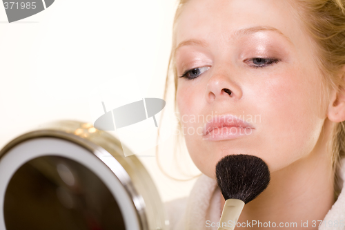 Image of Putting on makeup