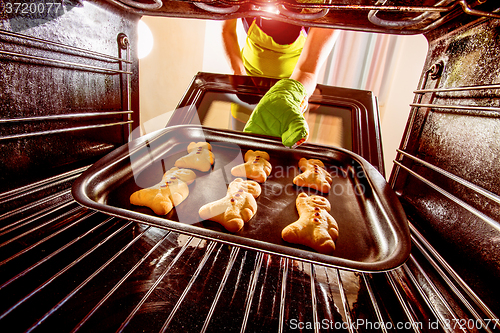 Image of Baking Gingerbread man in the oven